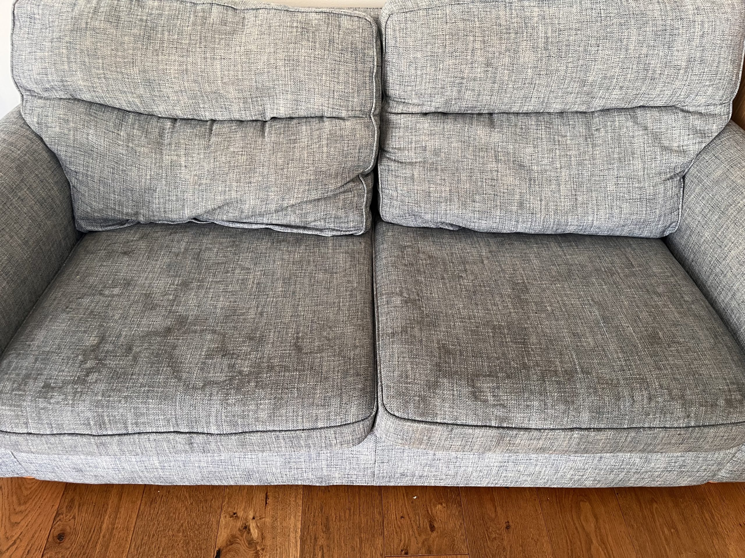 Fabric sofa before professional upholstery cleaning